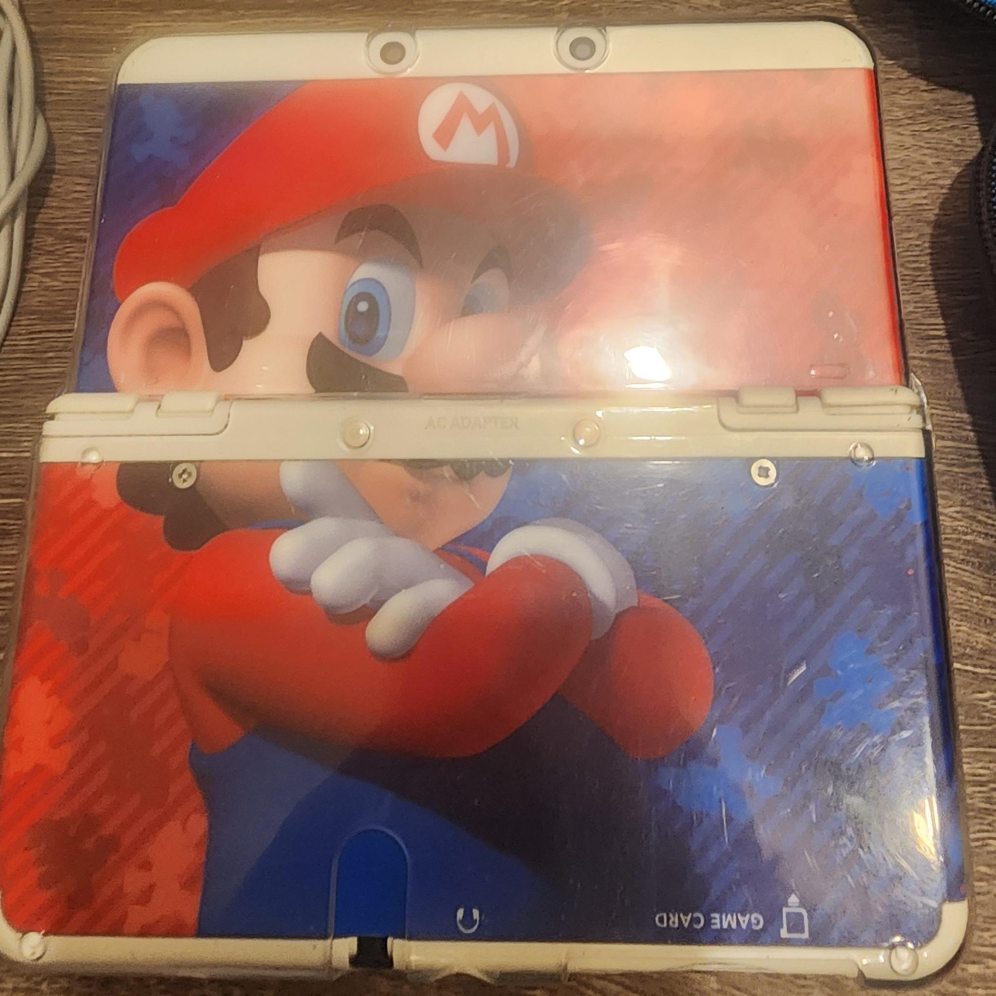 New Nintendo 3DS (Non-XL), Games, Case, 2 chargers, and clear case on console, 32gb microSD