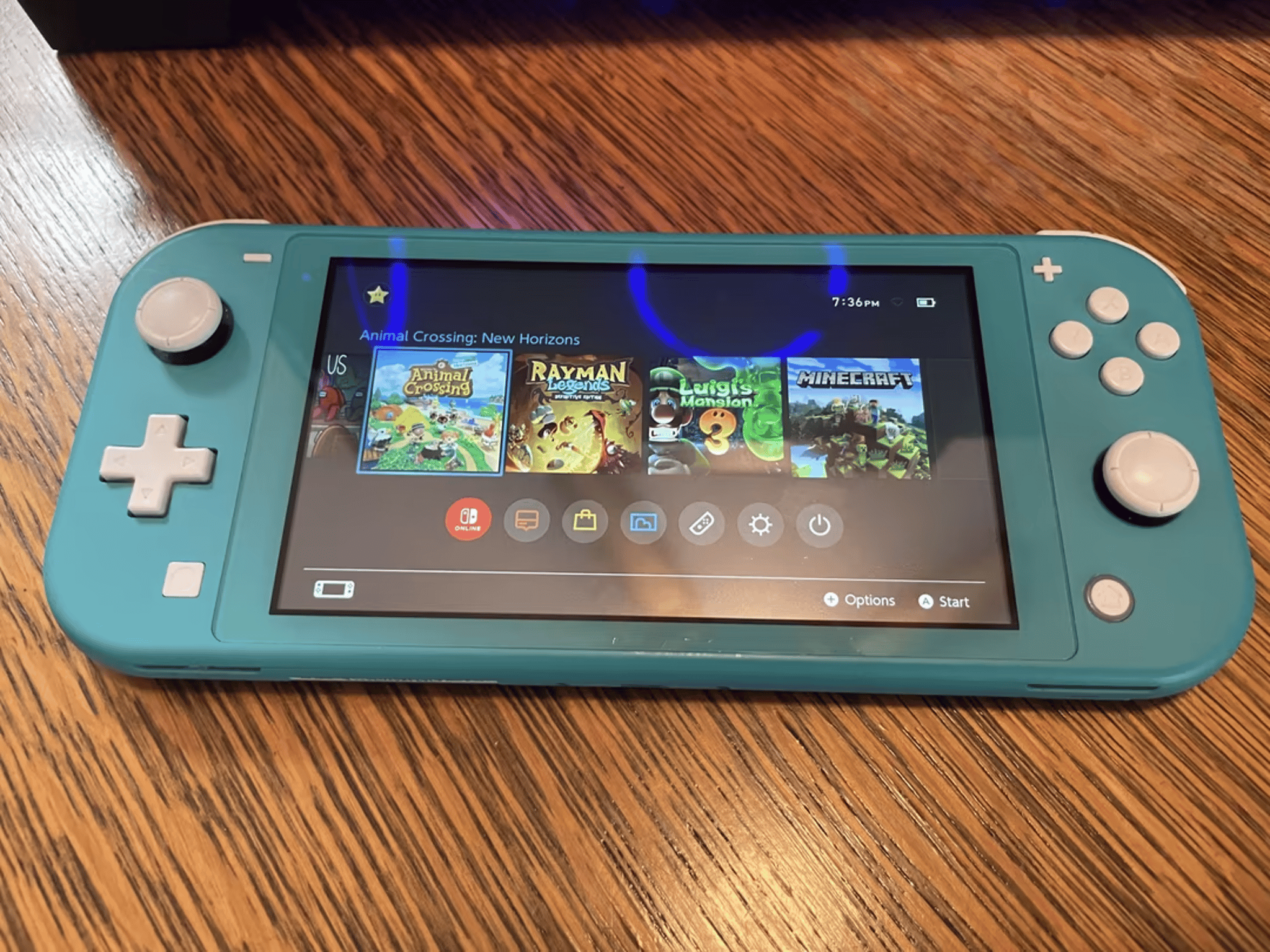 Turquoise Nintendo Switch Lite w/ loaded 128GB microSD + case