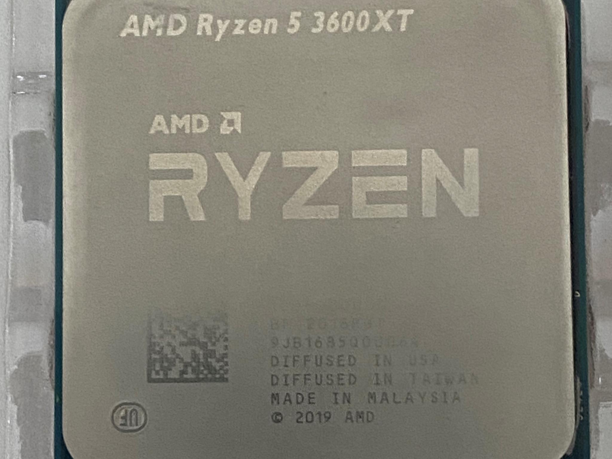 AMD Ryzen 5 3600XT 3.8 GHz 6-Core Processor and AMD Cooler in box.