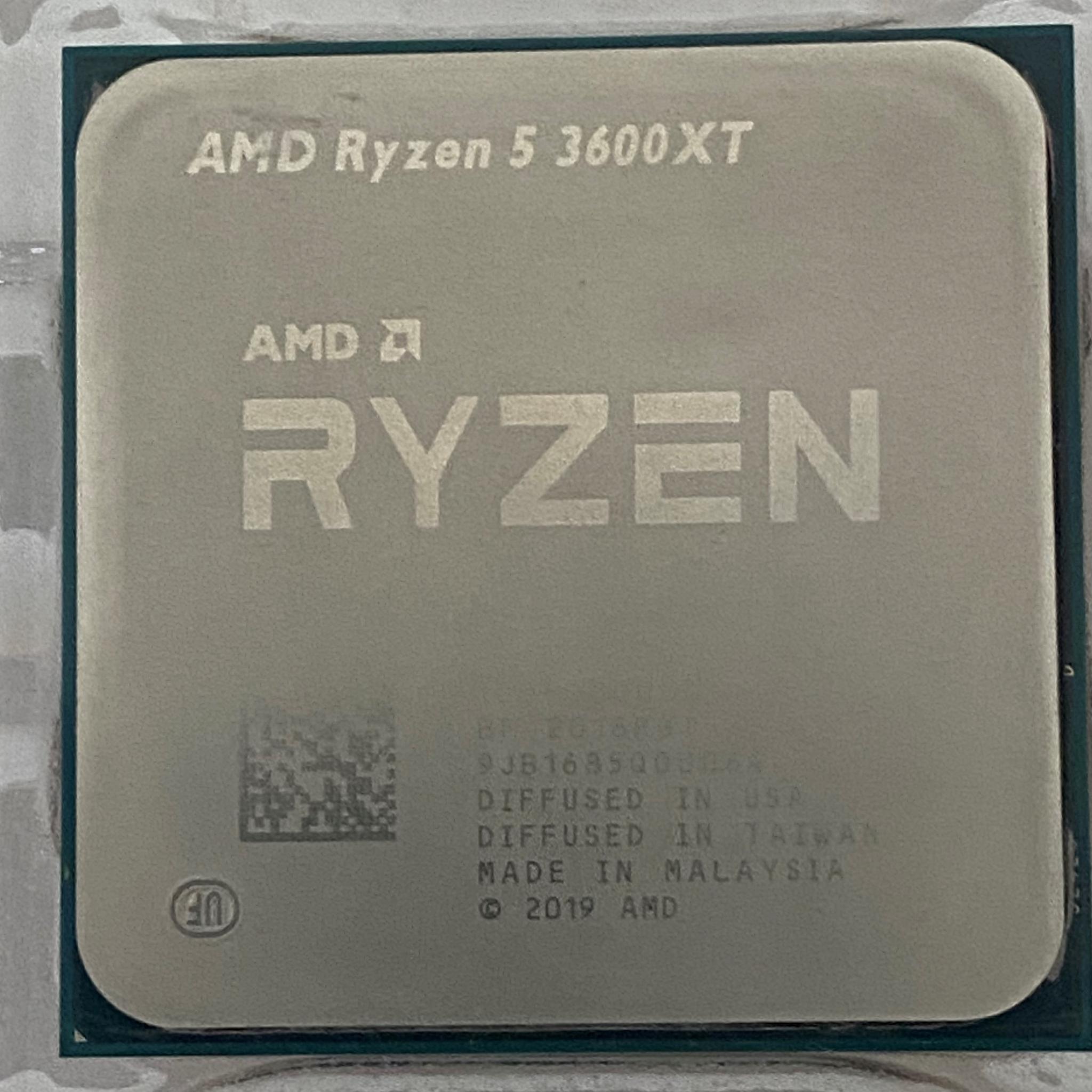 AMD Ryzen 5 3600XT 3.8 GHz 6-Core Processor and AMD Cooler in box.