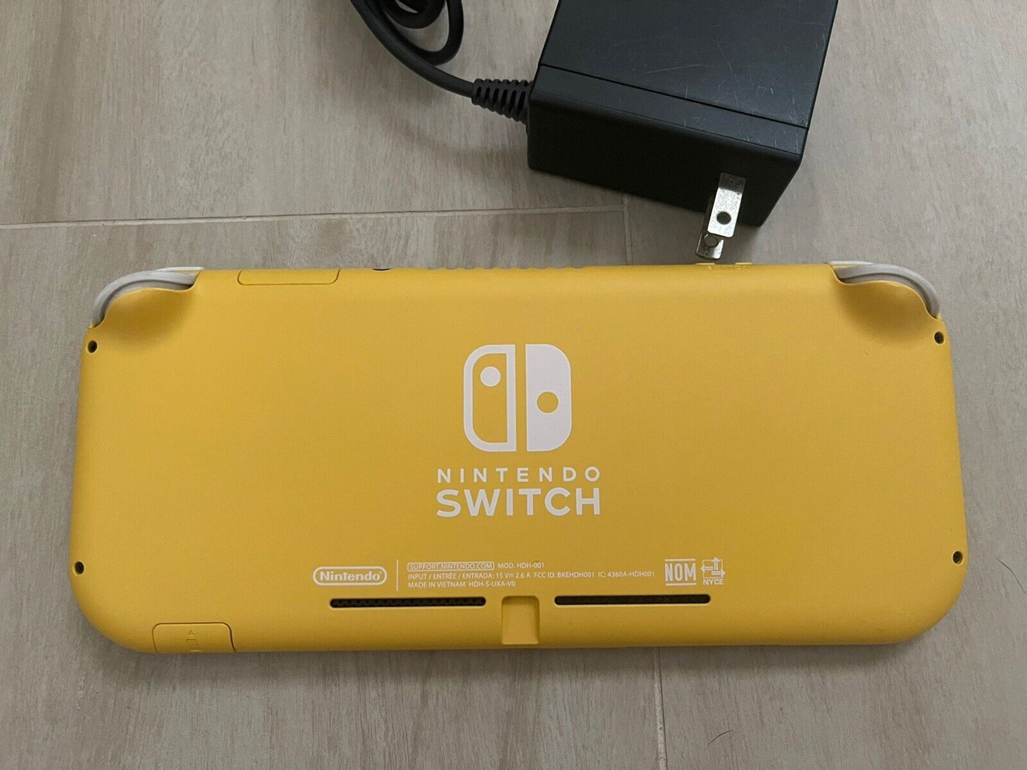 Nintendo Switch Lite Yellow Handheld Console With OEM Power Supply