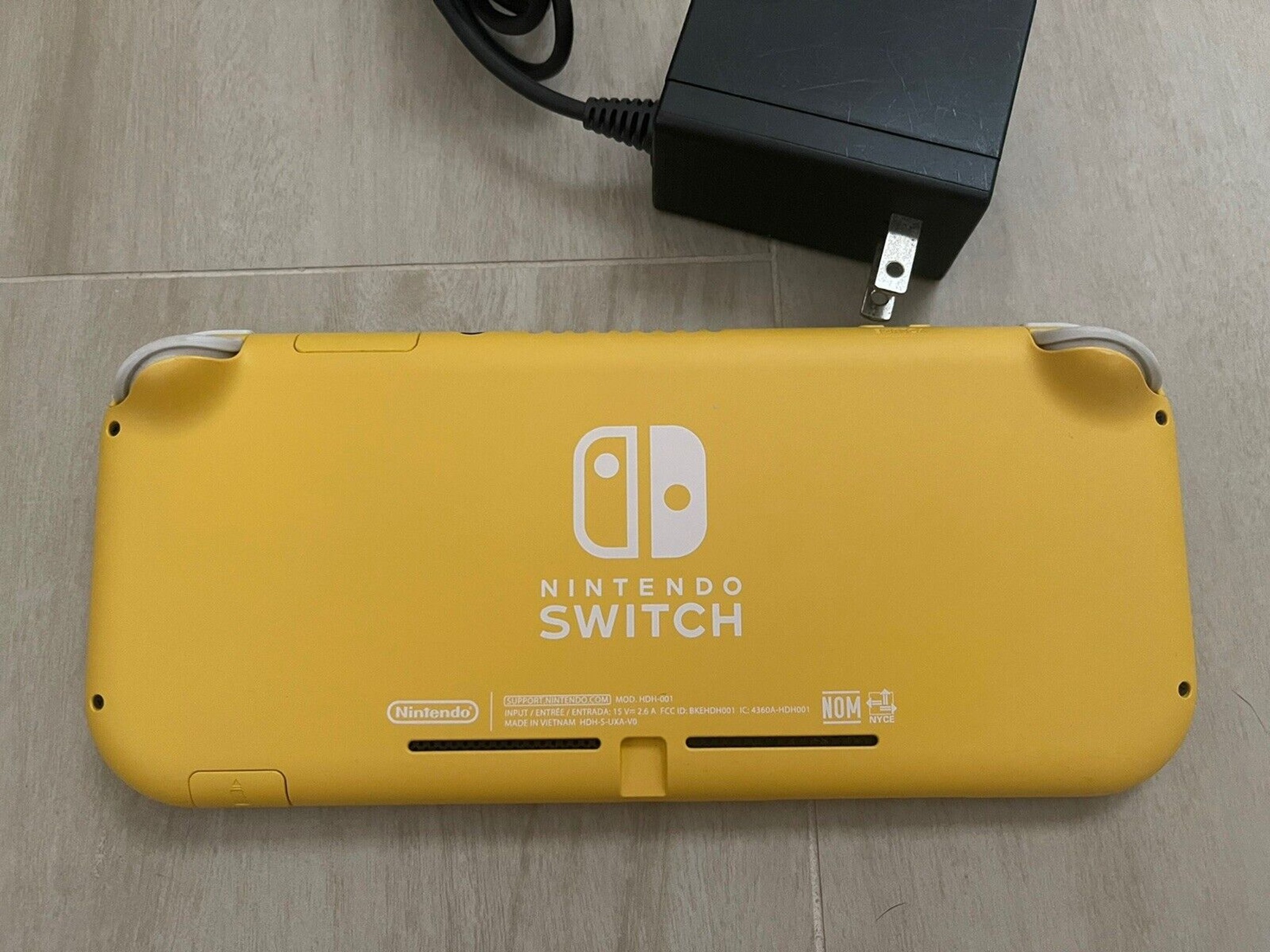 Nintendo Switch Lite Yellow Handheld Console With OEM Power Supply