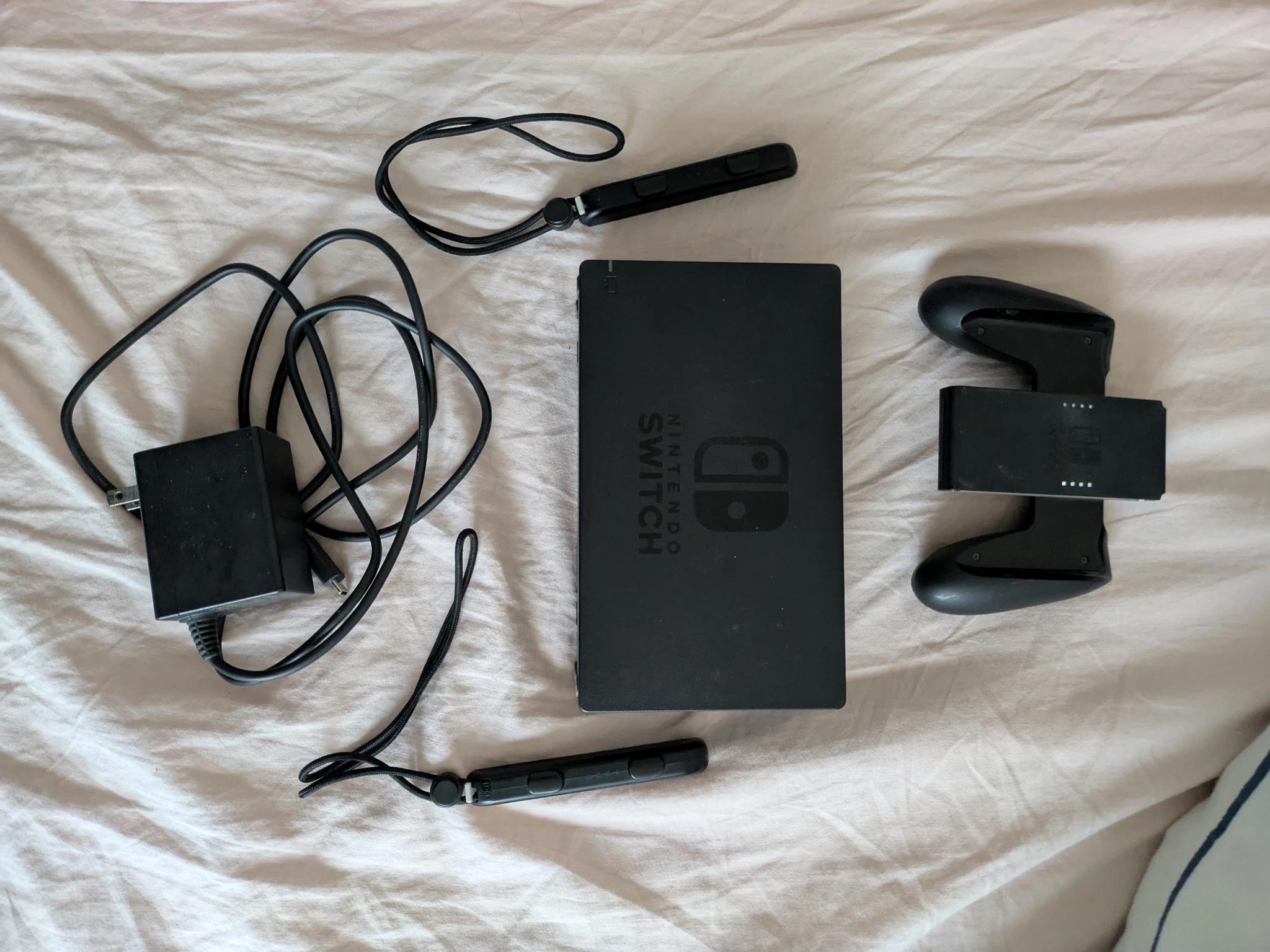 Nintendo Switch with Dock, Charger and controller base with 128GB SD card
