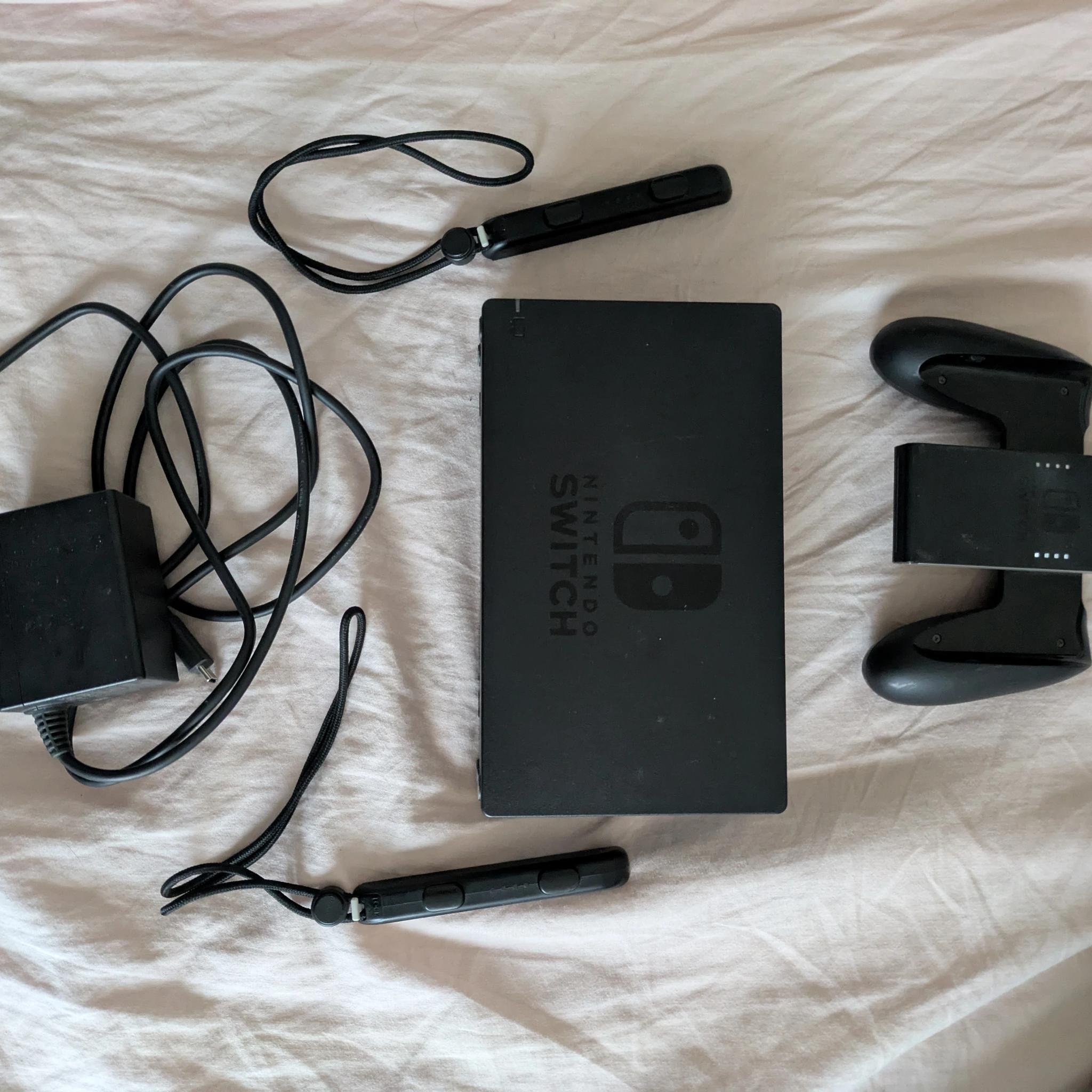 Nintendo Switch with Dock, Charger and controller base with 128GB SD card