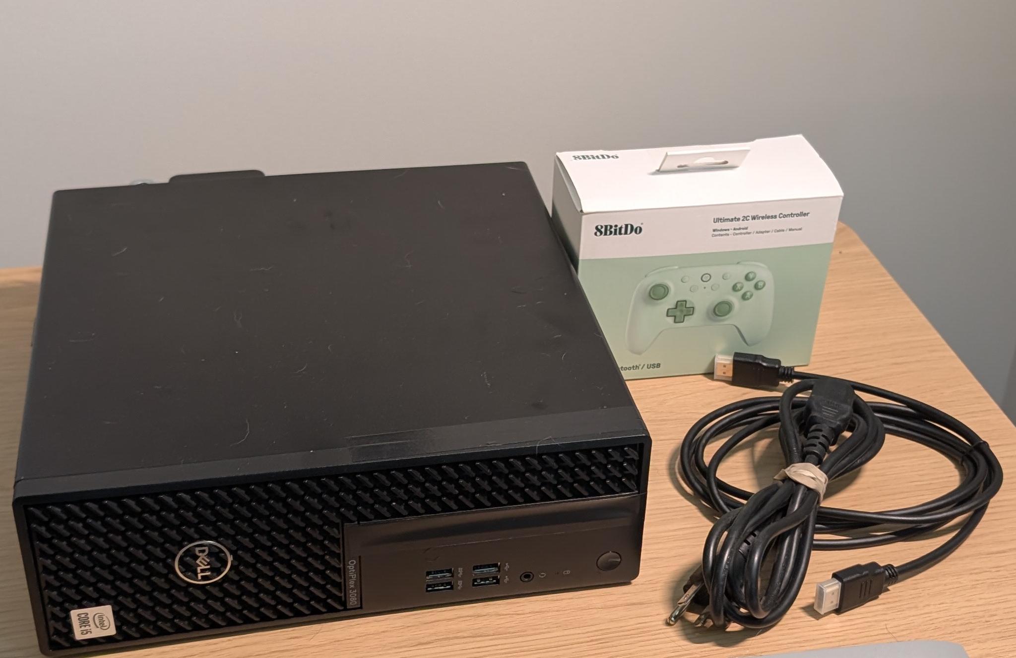 Dell Optiplex with visible damage, refurbished as a cheap steam box running bazzite