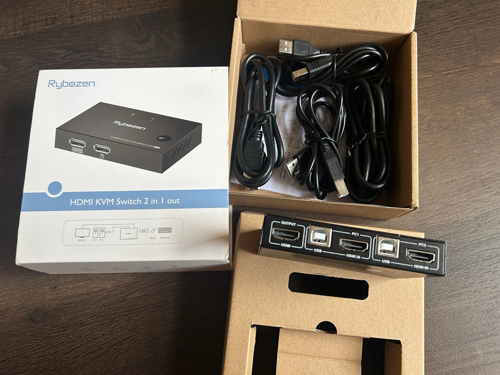 KVM Switch it connects 1 Keyboard, 1 Mouse  and 1 HDMI to 2 computers