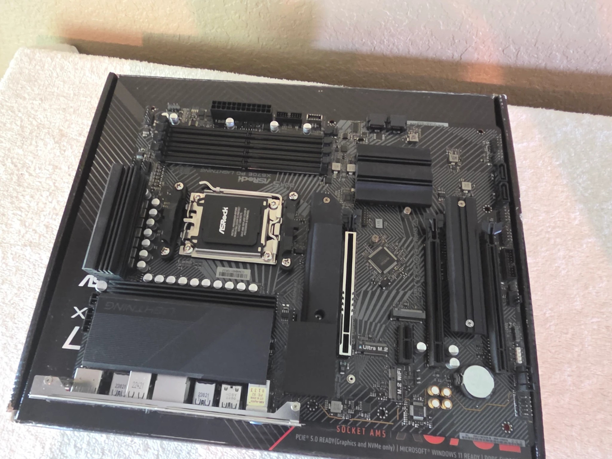 Used ASRock X670E PG Lightning motherboard with New AMD Ryzen 5 9600X