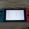 Nintendo Switch with Dock, Charger and controller base with 128GB SD card