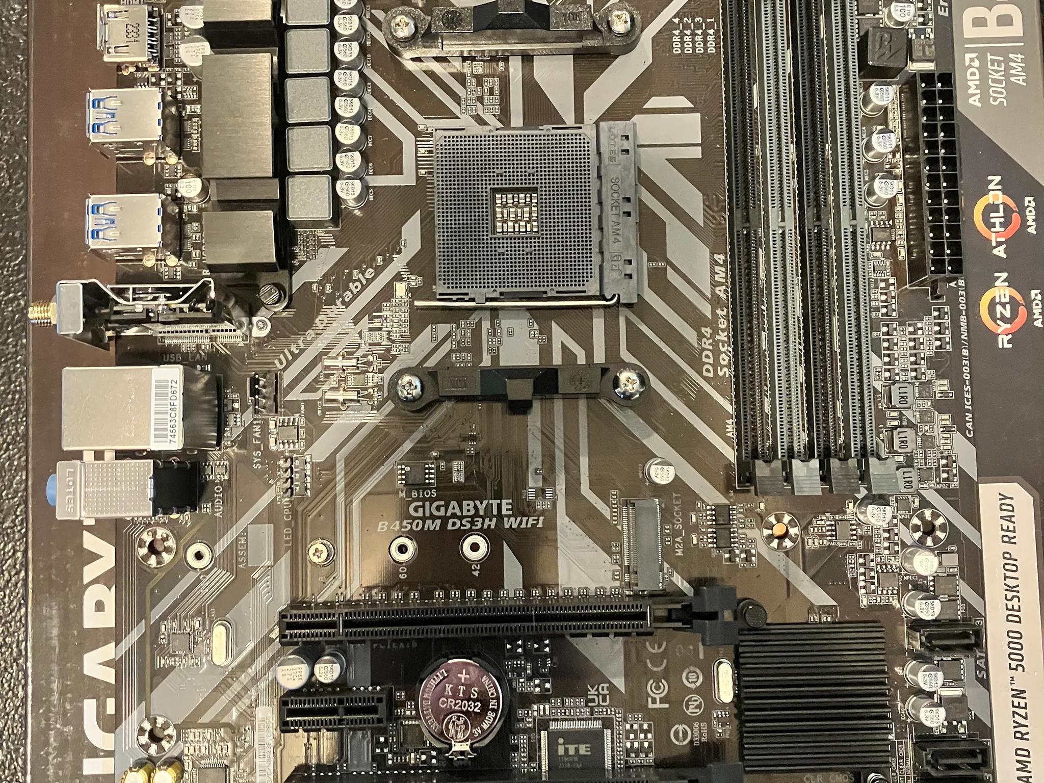 Open Box: Gigabyte B450M DS3H Wi-Fi Micro ATX AM4 DDR4 Motherboard W/ IO shield.