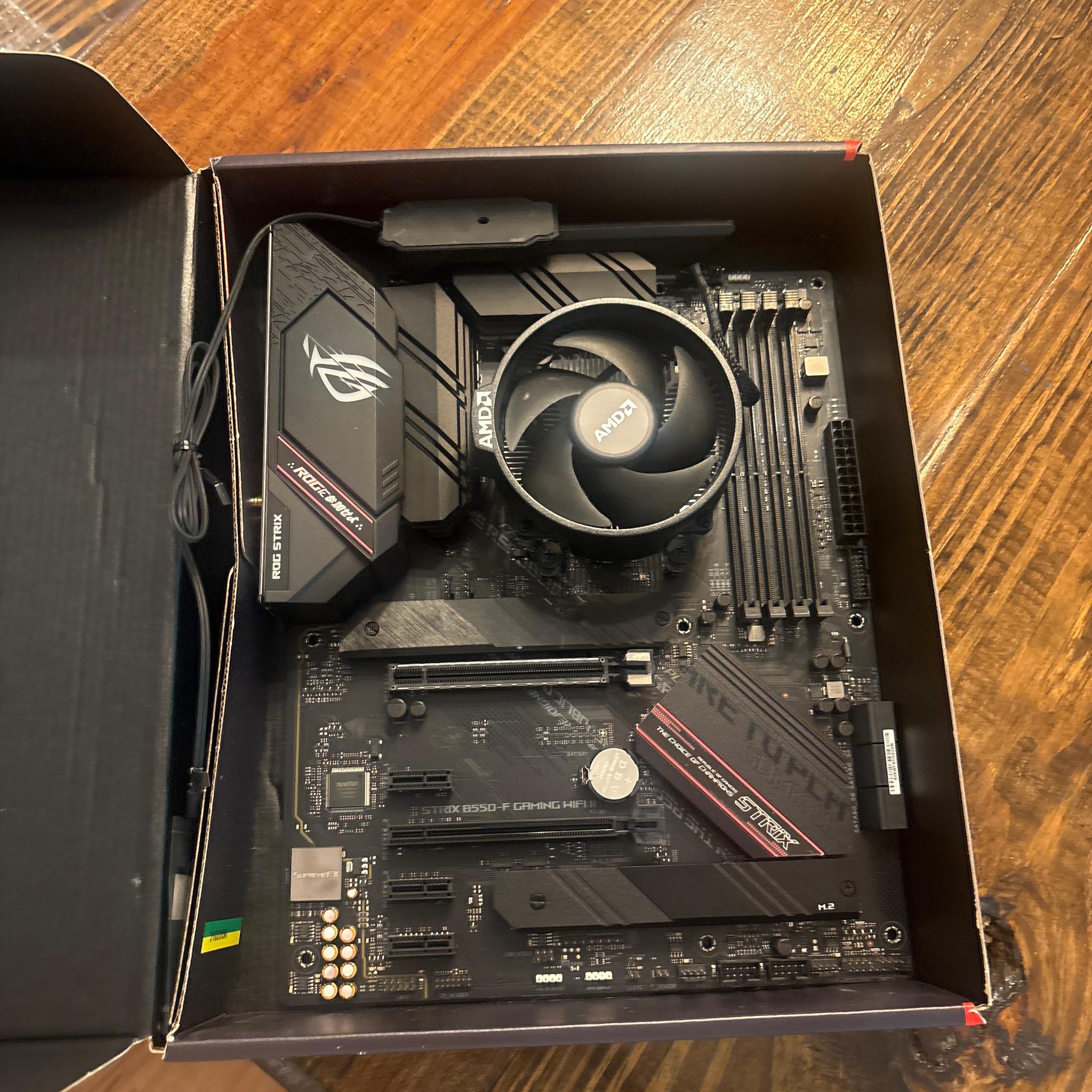 Used but good condition Rog motherboard and Ryzen 5 5500 CPU with stock AMD cooler