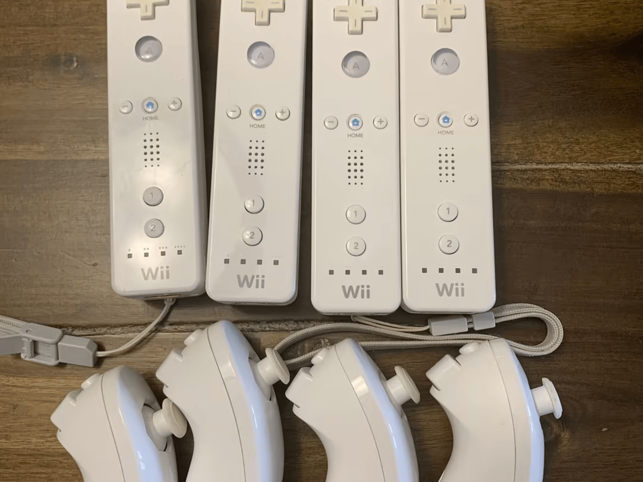 (4) Wii Remotes w/ Nunchuks