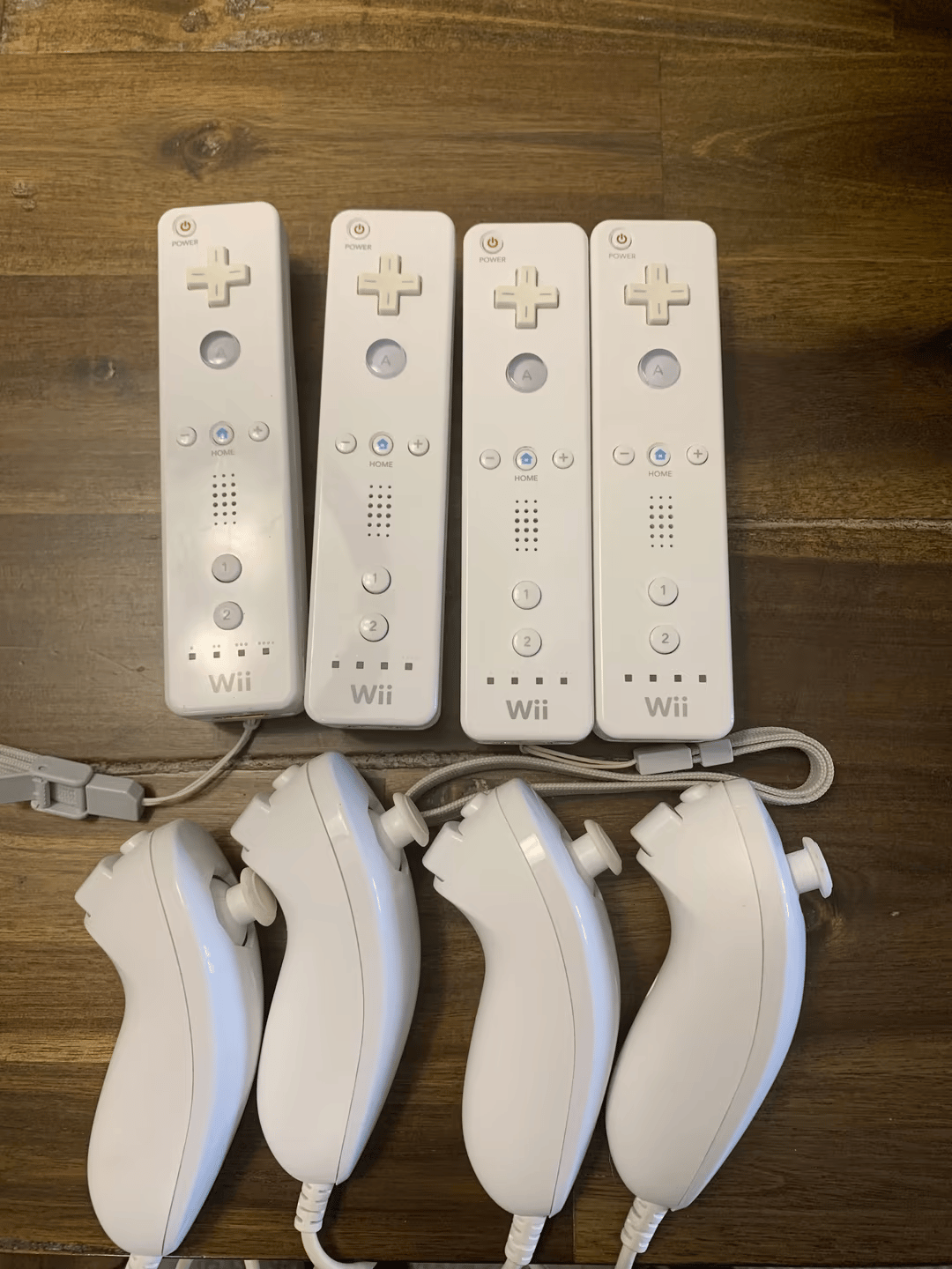 (4) Wii Remotes w/ Nunchuks