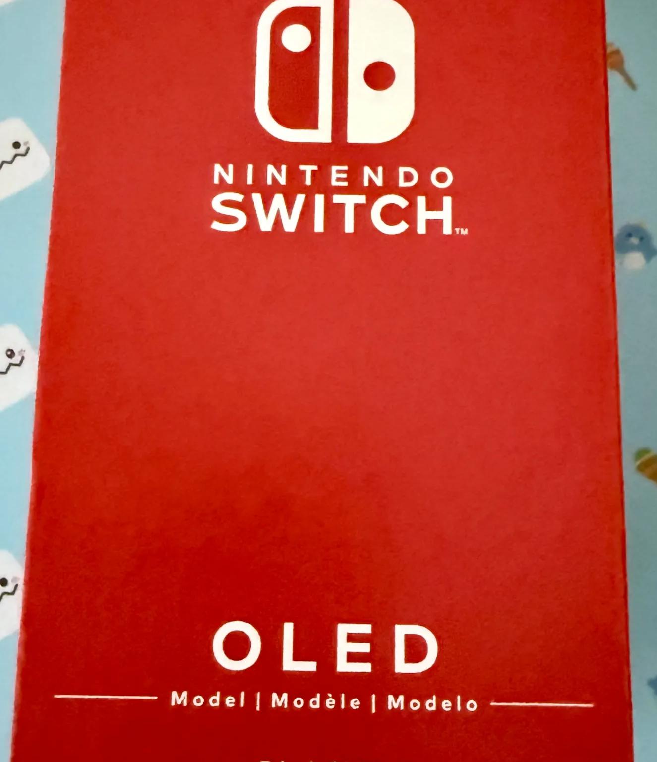 Nintendo Switch – OLED Model w/ White Joy-Con
