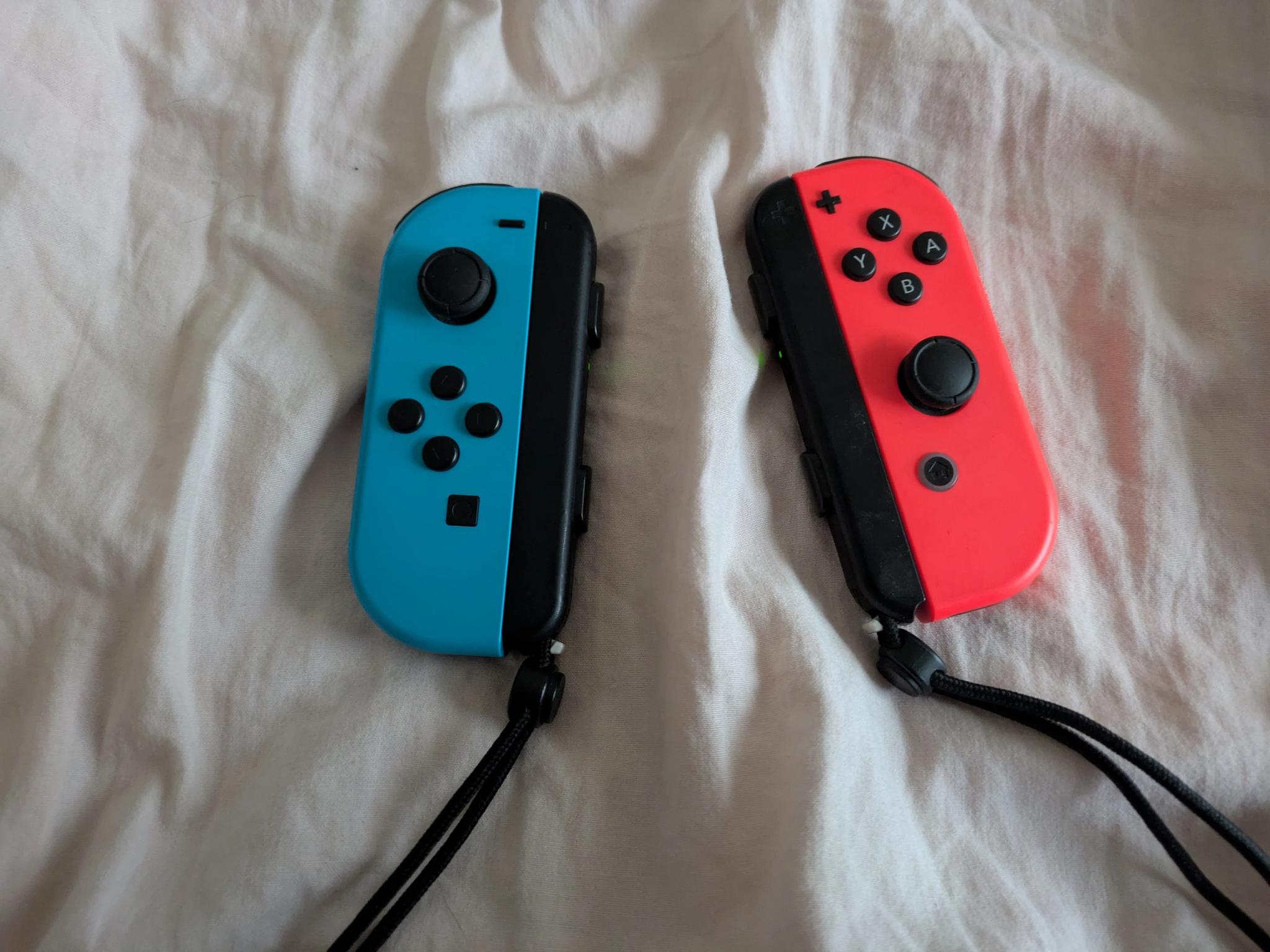 Nintendo Switch with Dock, Charger and controller base with 128GB SD card