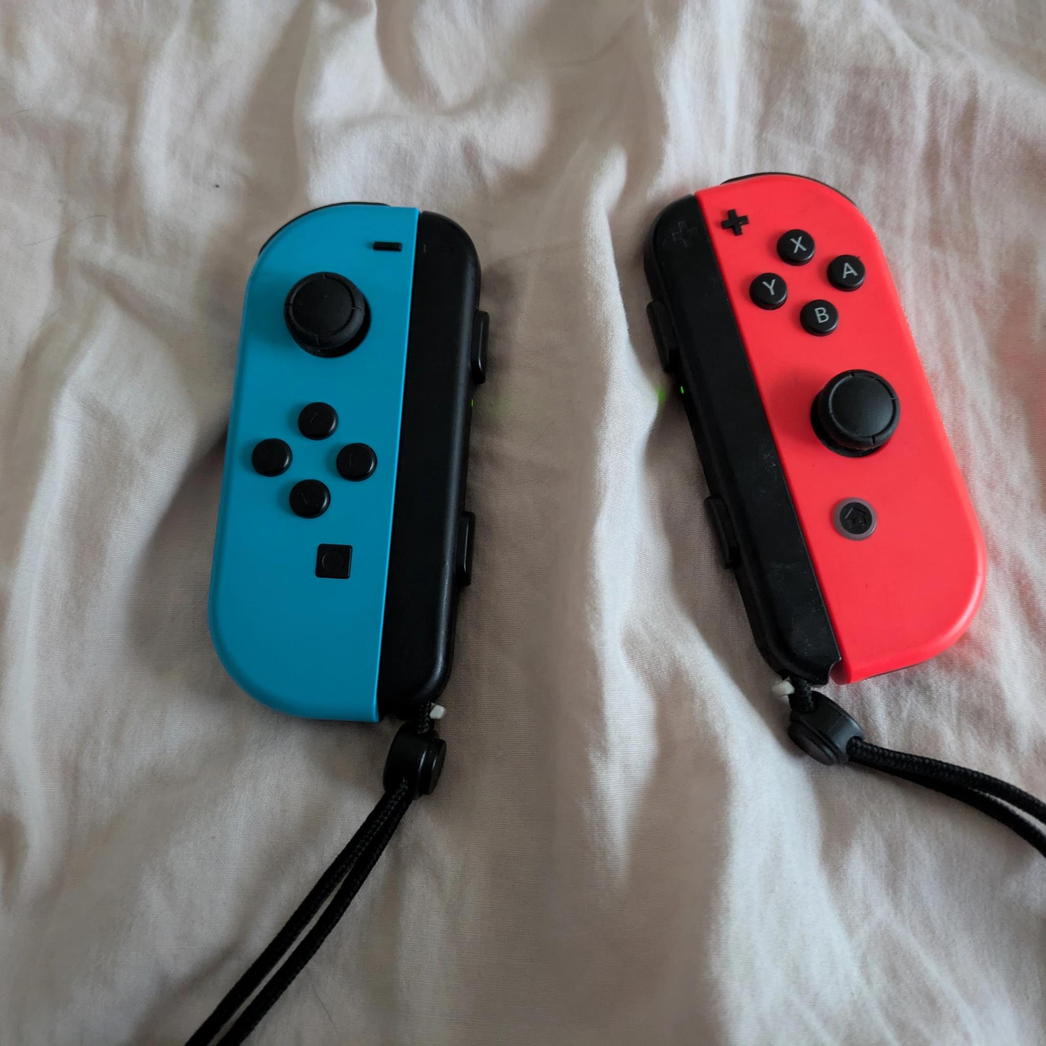 Nintendo Switch with Dock, Charger and controller base with 128GB SD card