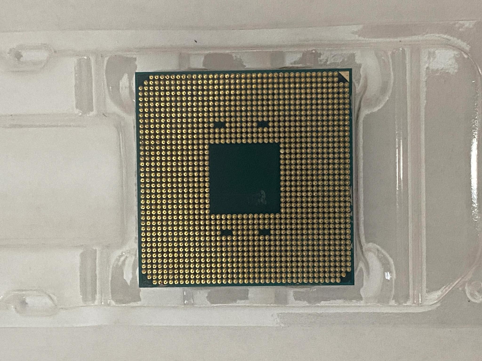 AMD Ryzen 5 3600XT 3.8 GHz 6-Core Processor and AMD Cooler in box.