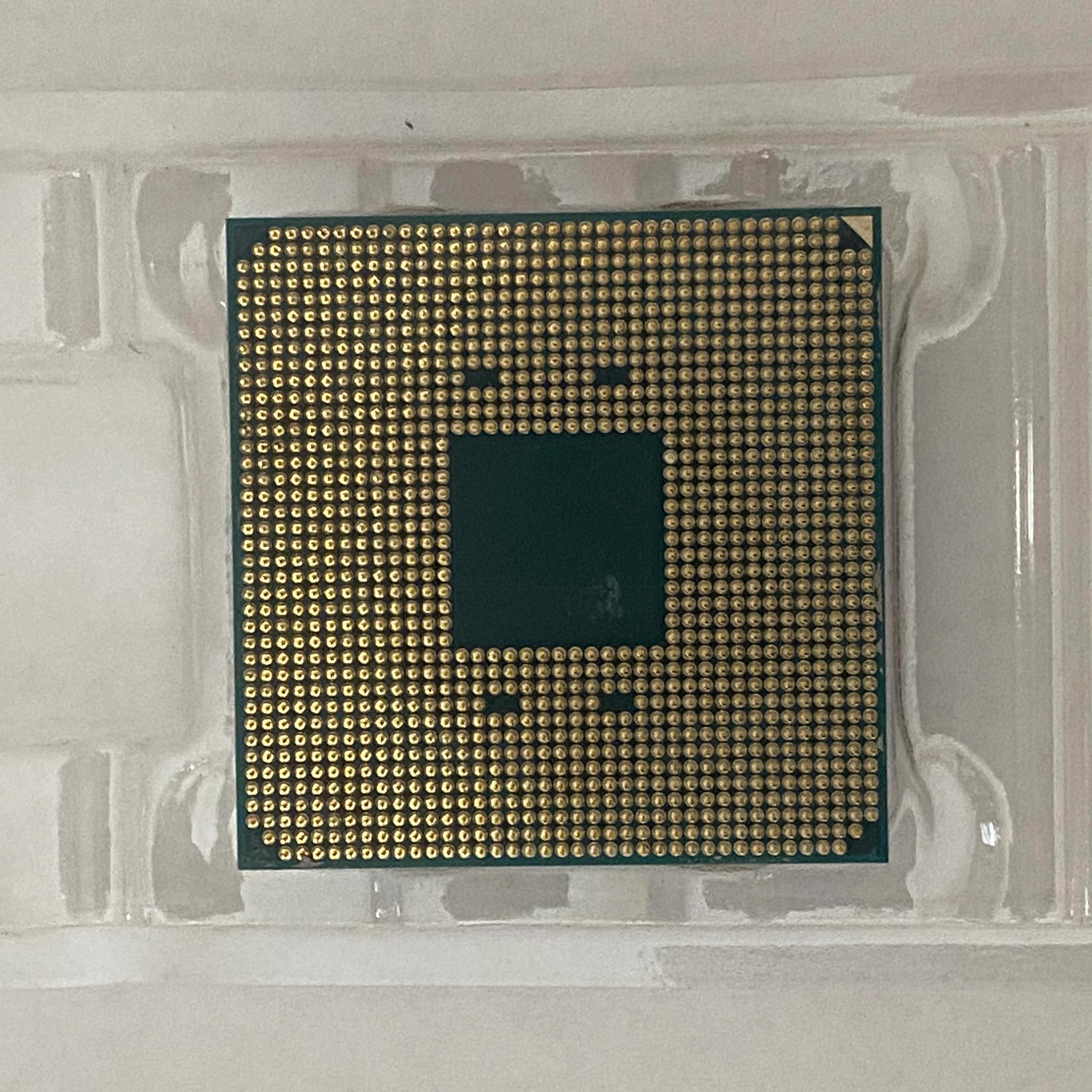 AMD Ryzen 5 3600XT 3.8 GHz 6-Core Processor and AMD Cooler in box.